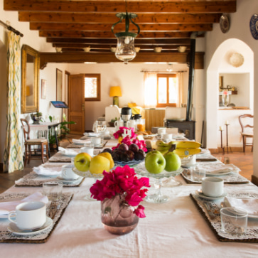 Table with plates and cutlery in a dining room